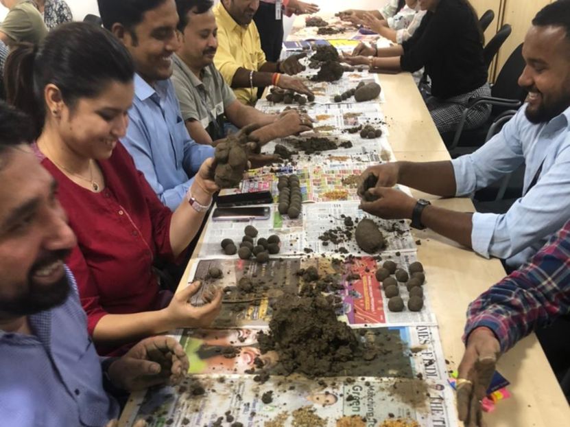 Volunteers assembling recycled furniture
